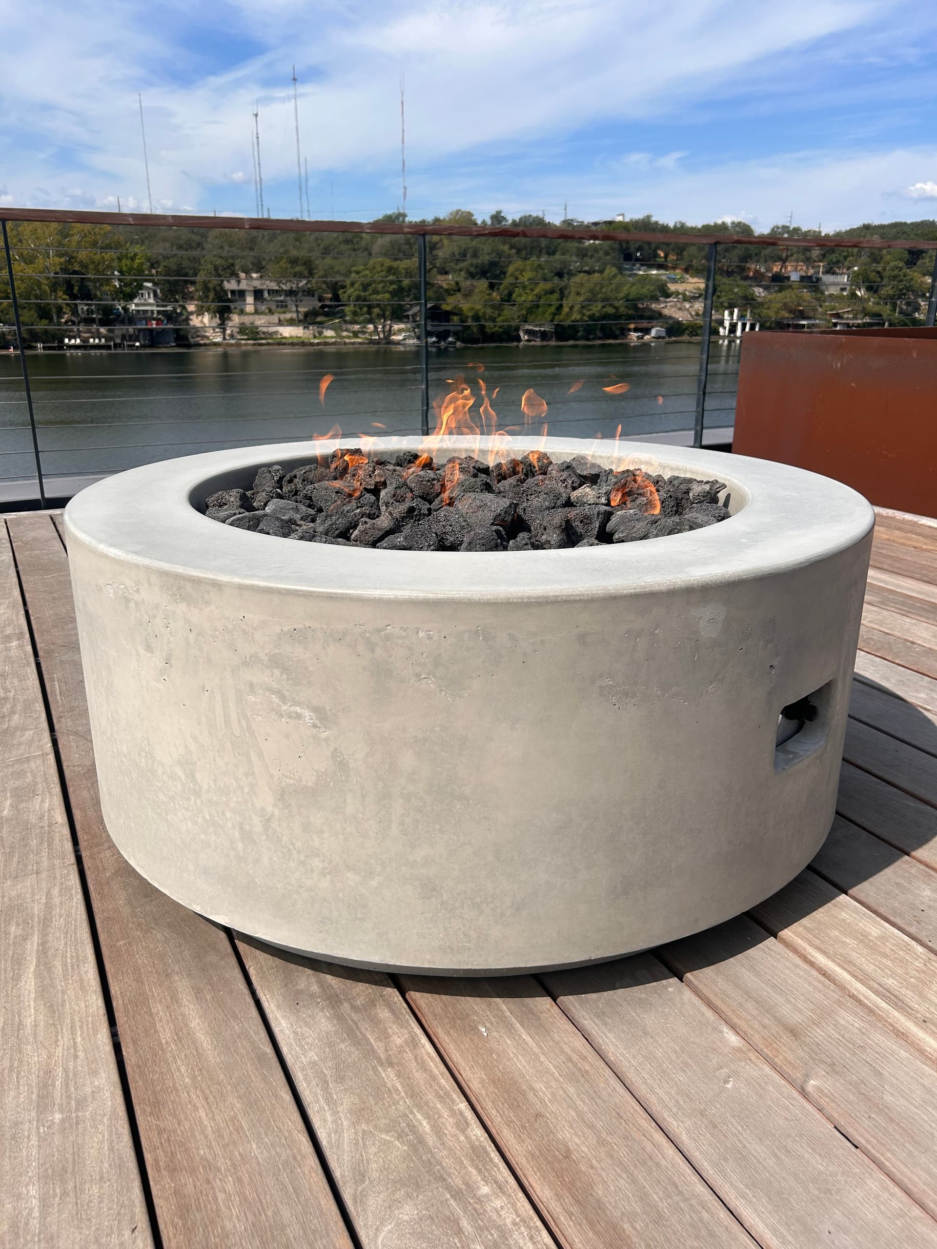 Custom concrete fire pit in outdoor living space